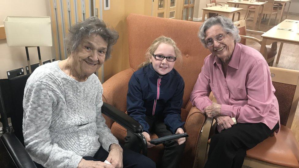 Schoolchildren visiting residents at Cardiff care home