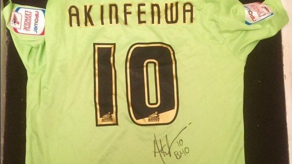 Adebayo Akinfenwa's signed match shirt