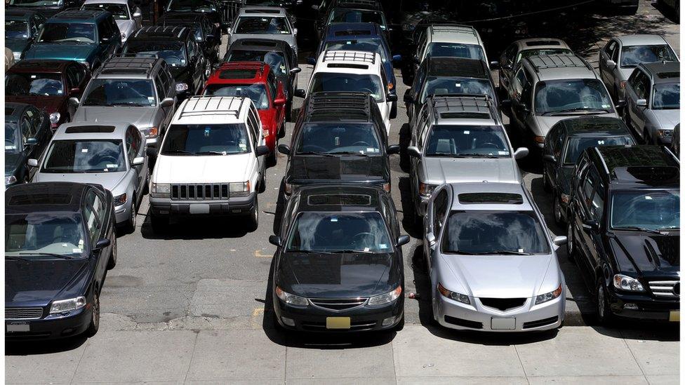 Cars in parking lot.