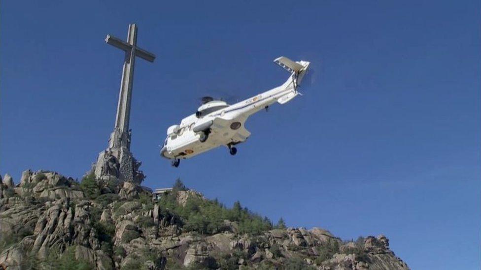 A helicopter carrying the coffin with the remains of Spanish late dictator Francisco Franco as it takes off in The Valley of the Fallen in San Lorenzo de El Escorial, Spain, 24 October 2019