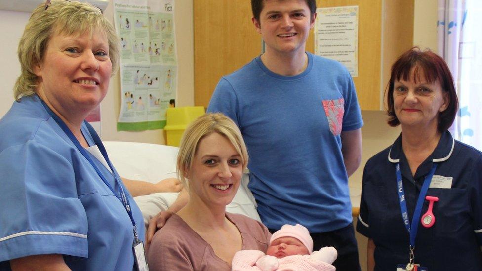 Baby Sienna, with parents and hospital staff