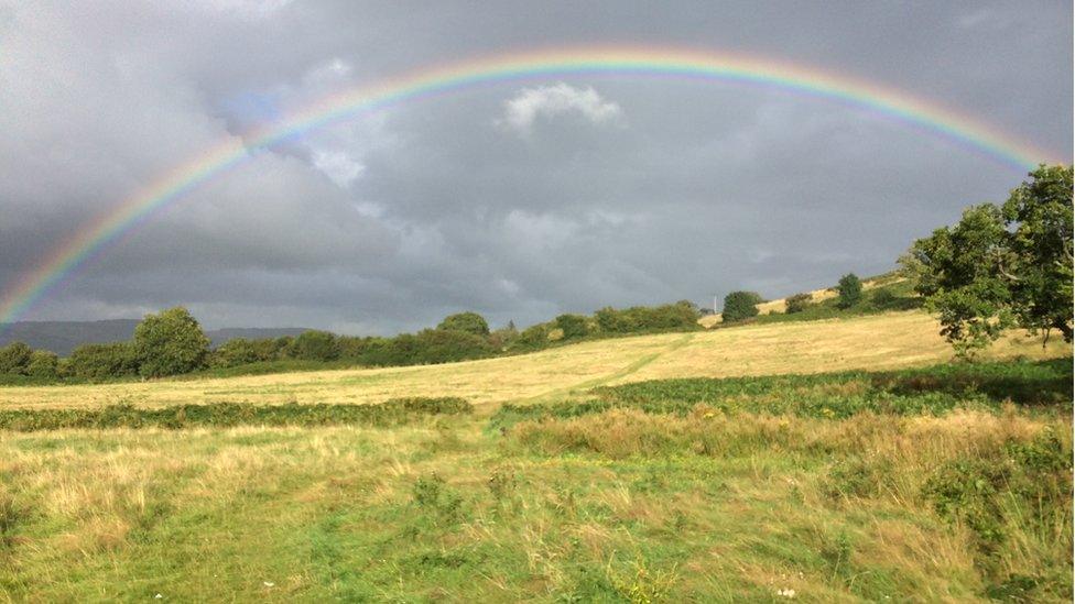 Rainbow over a field at Gwern y Domen, Caerphilly