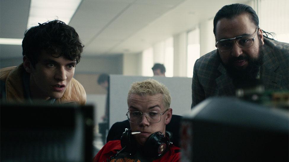 Fionn Whitehead, Will Poulter and Asim Chaudhry in Black Mirror: Bandersnatch