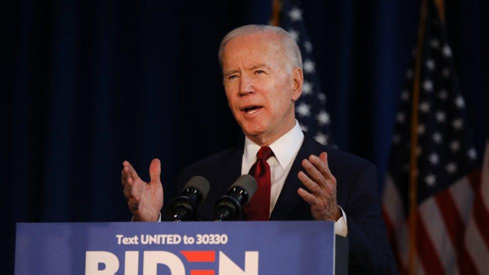 Joe Biden speaking at a podium