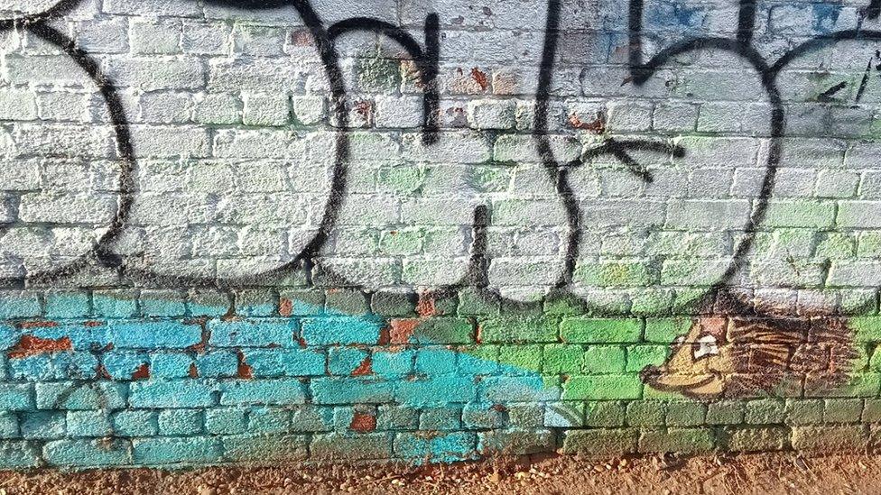 Vandalised artwork in Newark underpass