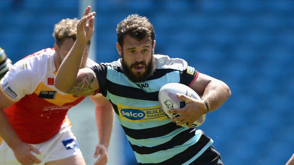 Scott Moore of London Broncos gets past Thomas Bosc of Catalan Dragons during the Super League on May 17, 2014