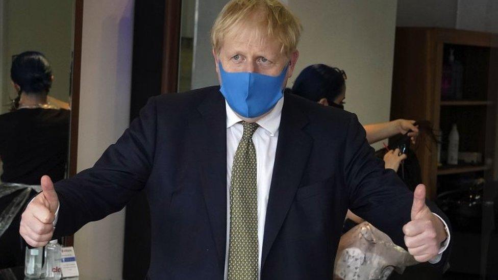 Boris Johnson wearing a mask