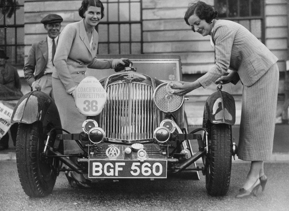 1935 - An Aston Martin getting a final polish at a car show in Cardiff