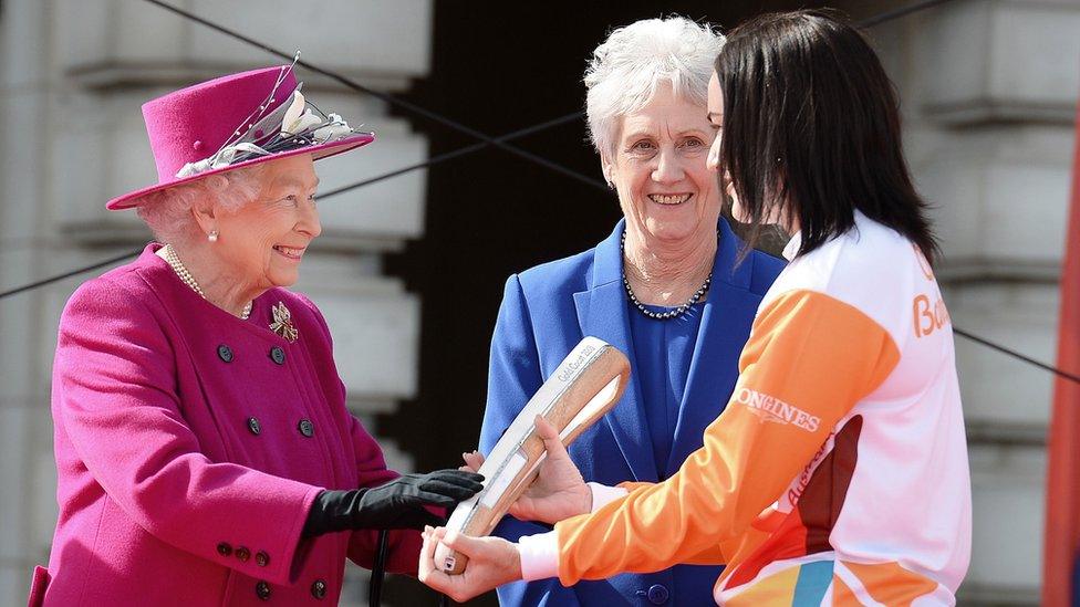 Queen handing over baton