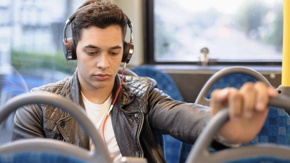 young person on a bus