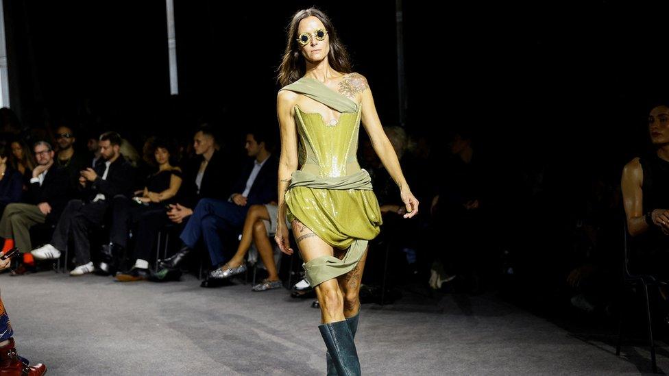 A model presents a creation by designer Andreas Kronthaler as part of his Spring/Summer 2024 Women's ready-to-wear collection show for fashion house Vivienne Westwood, during Paris Fashion Week in Paris, France