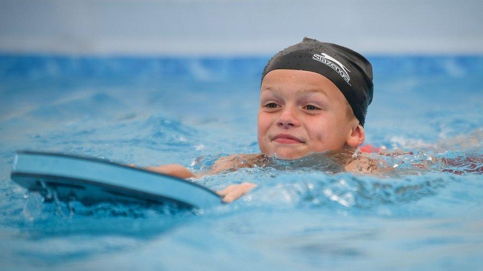 Young boy swimming