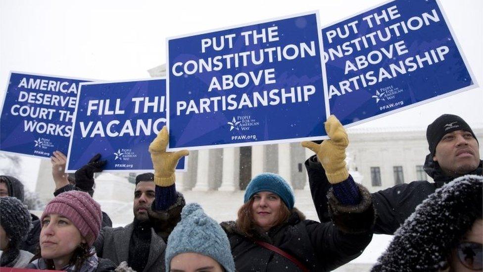 A group with "People for the American Way" from Washington, gather with signs in front of the US Supreme Court in Washington,on 15 February 2016