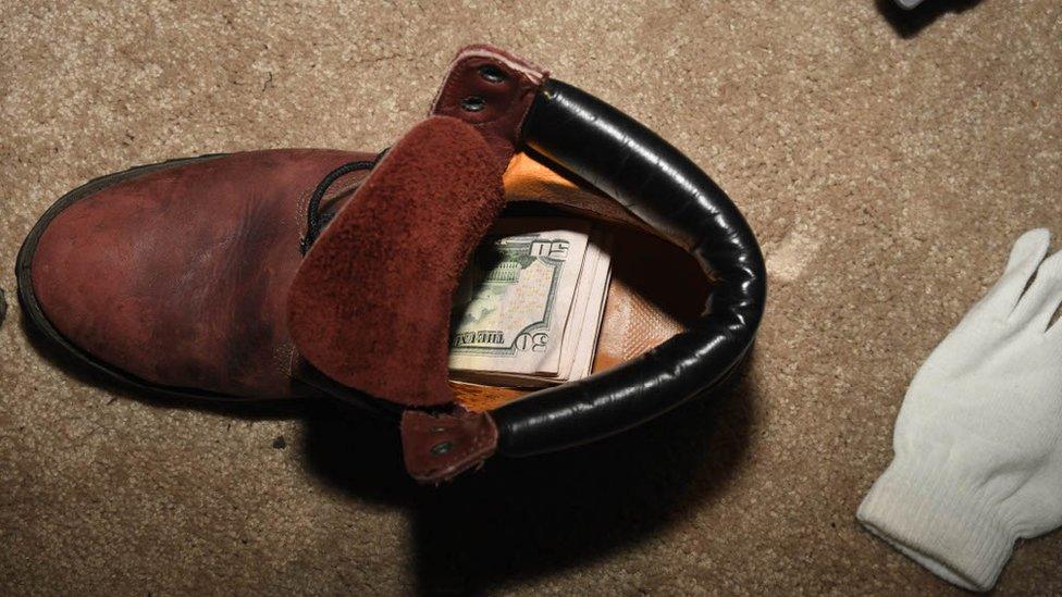 Money stuffed in a shoe