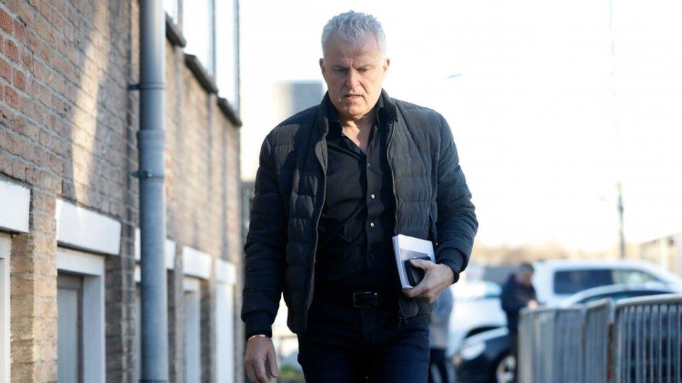 Crime reporter Peter R de Vries arrives at the heavily secured court house in Osdorp, the Netherlands