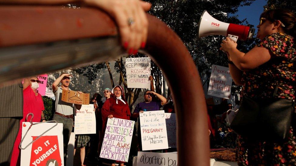 Pro-choice supporters protest in front of the Alabama State House as Alabama state Senate votes on the strictest anti-abortion bill in the United States