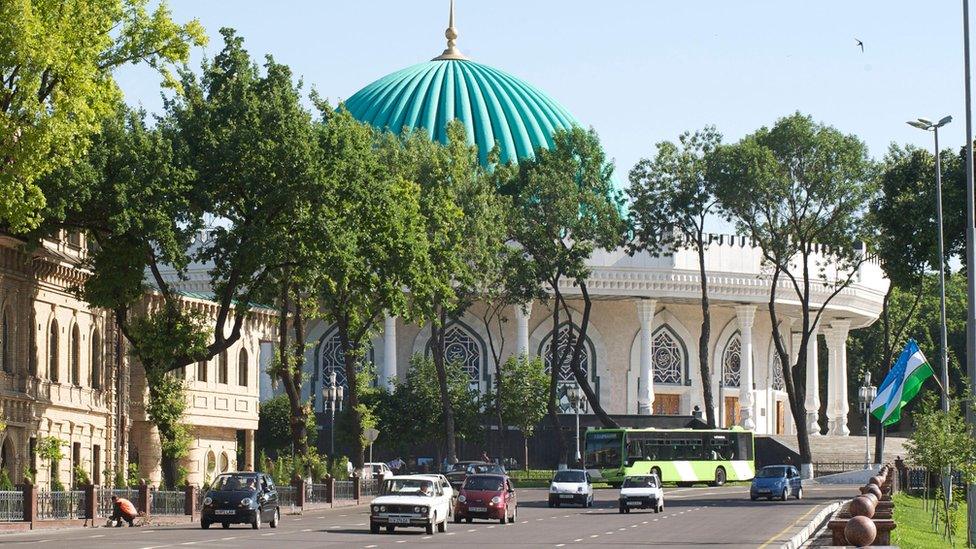 Traffic in Tashkent including a Soviet-era car