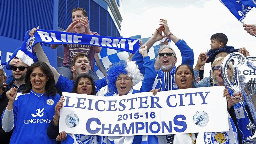 Leicester City fans outside the King Power Stadium celebrate winning Premier League title