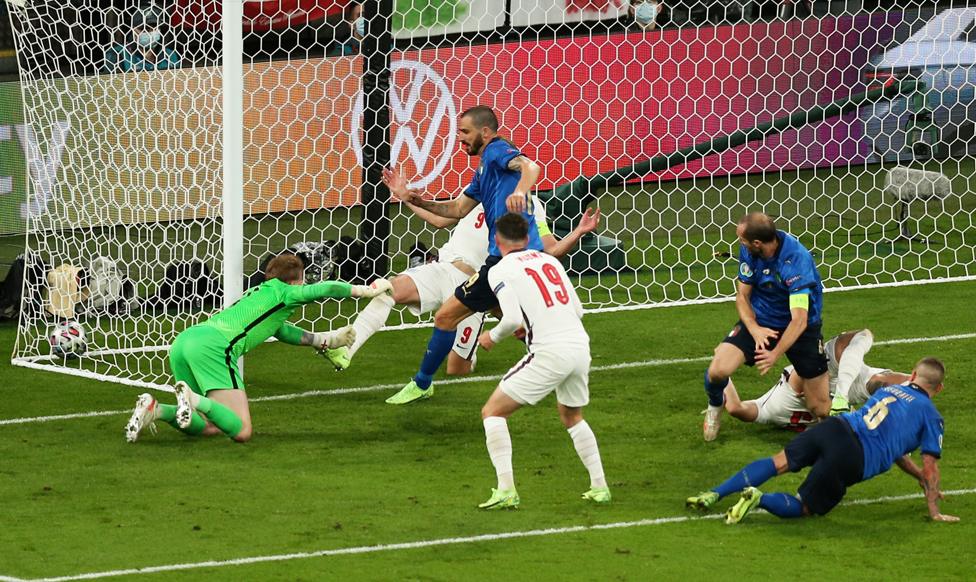 Leonardo Bonucci of Italy scores their side's first goal past Jordan Pickford of England during the UEFA Euro 2020 Championship Final between Italy and England at Wembley Stadium on July 11, 2021 in London, England.