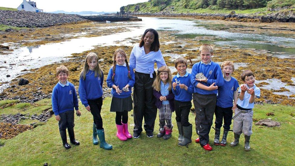 Whitney with school children.