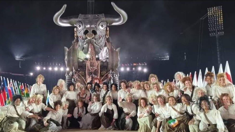 Volunteer performers with the bull at the Commonwealth Games opening ceremony