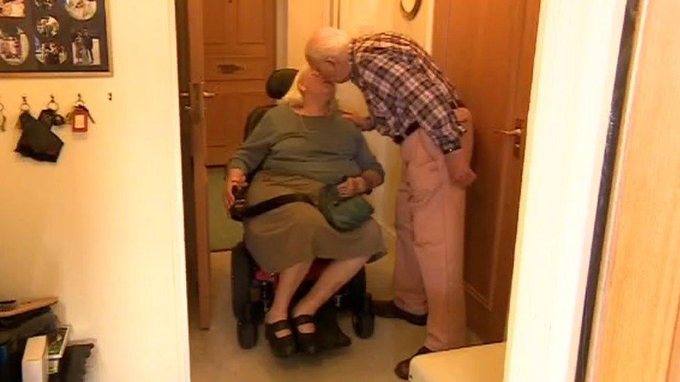 Julie and Graham Brown kiss as they are reunited in their flat in Wells