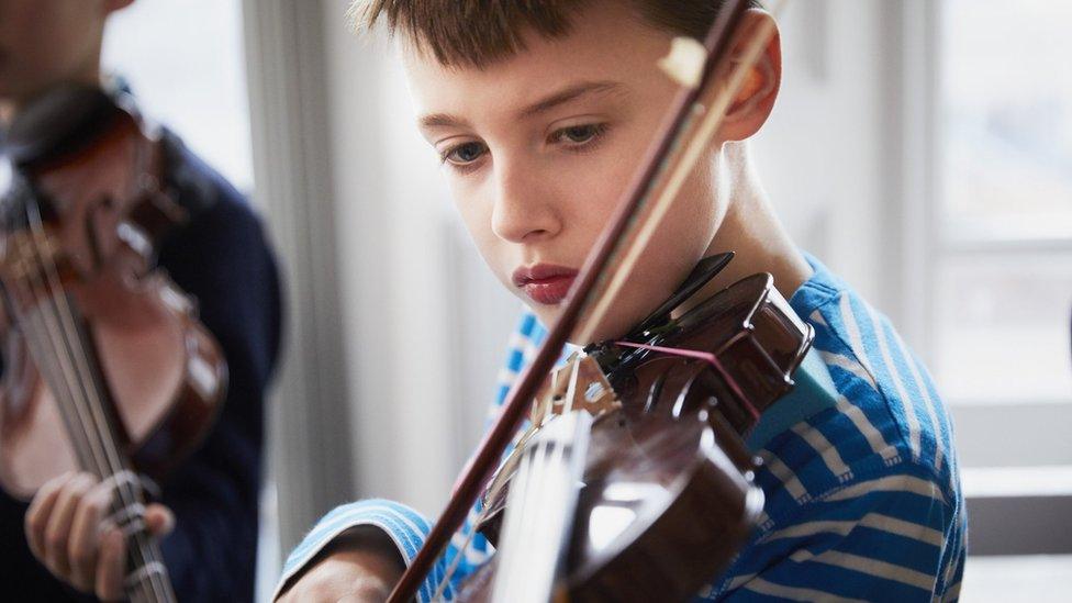 boy playing violin