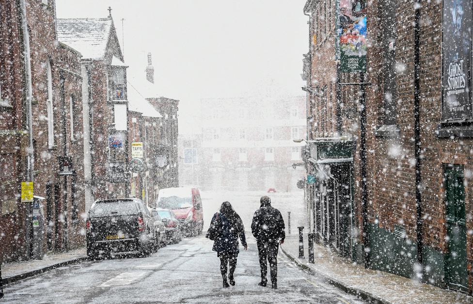 A snow shower falls in York city centre on 8 February 2021