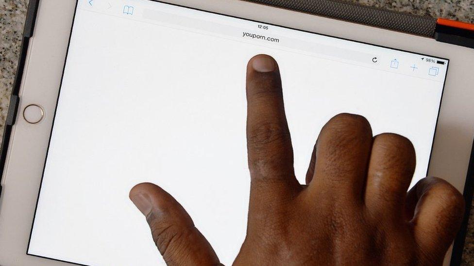 An Indian internet user points out at a porn site showing a blank screen after being blocked by the internet service providers based on directive issued by the telecom department to block porn websites across the country