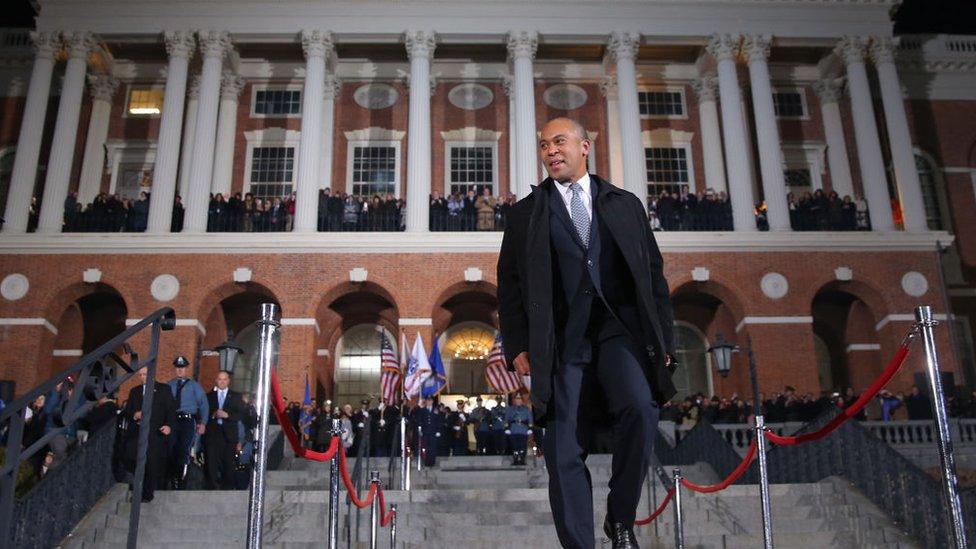 Then-Massachusetts Governor Deval Patrick leaves the state house in January 2015