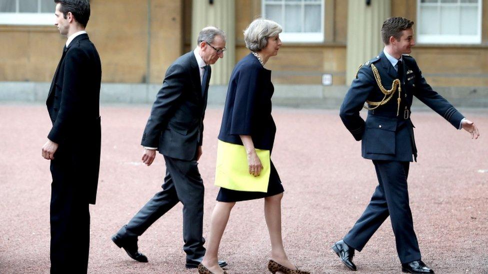 Theresa May arriving at Buckingham Palace with her husband Philip May