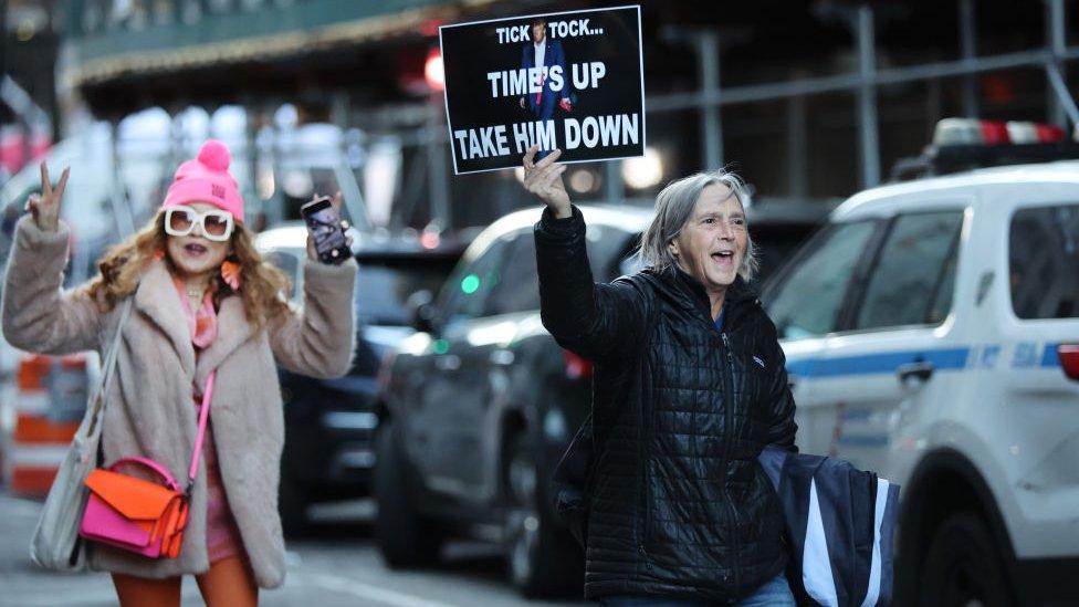 Protesters celebrate donald trump indictment