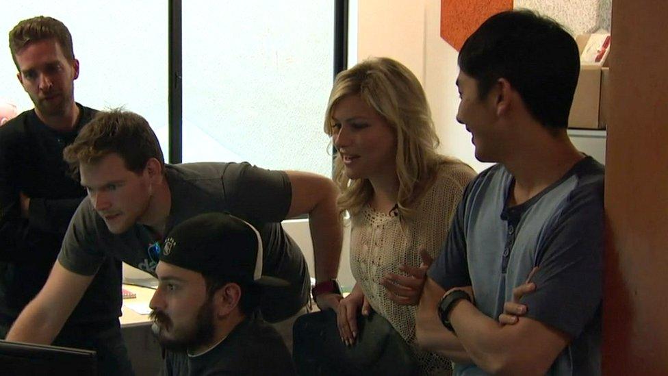 Meredith Perry and other engineers in front of a computer at uBeam's offices