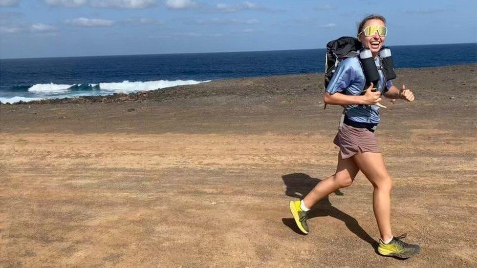 Ms Rainbow running on a beach