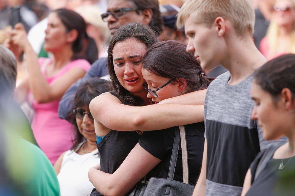 Mourners gather for a vigil held at Federation Square in Melbourne