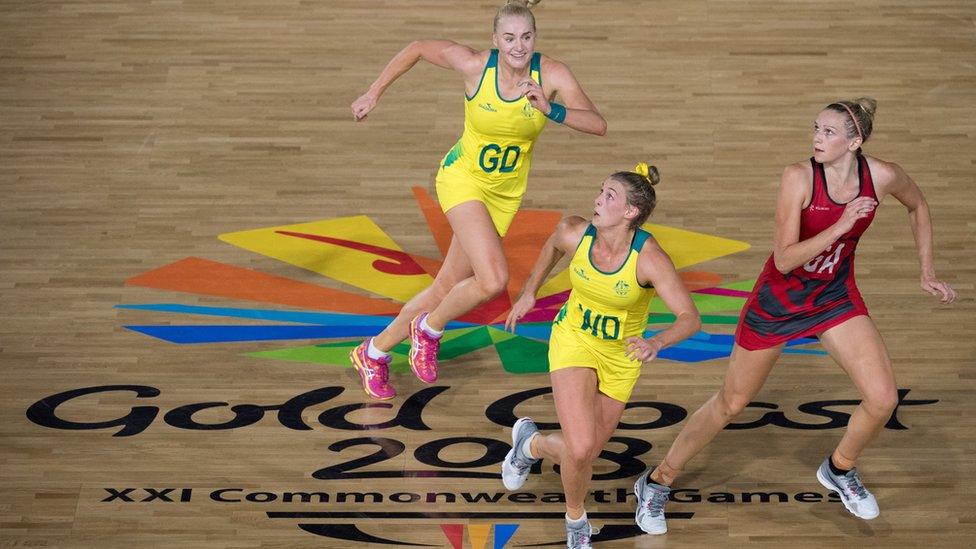 Australia's Joanna Weston, Gabi Simpson and England's Serena Guthrie (R) compete for the bale during their women's field netball gold medal match against England at the 2018 Gold Coast Commonwealth Games at the Gold Coast Coomera Indoor Sports Center on April 15, 2018.