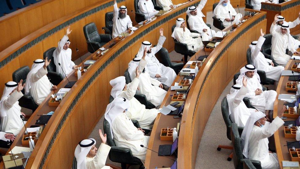 Kuwaiti MPs attend a parliament session at the National Assembly