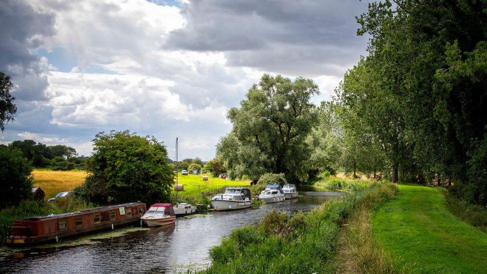 A general view of barges and boats on the River Great Ouse near Southery, Cambridgeshire