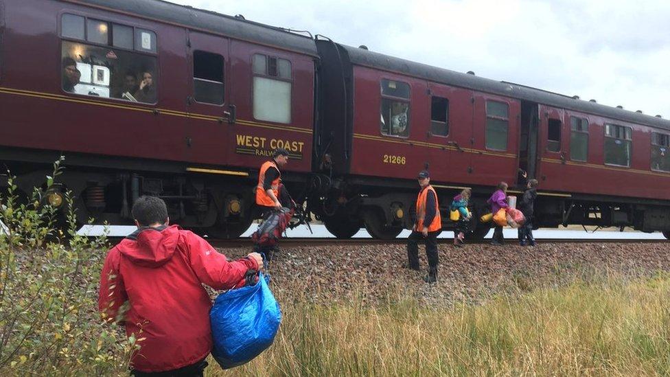 Family getting on to train