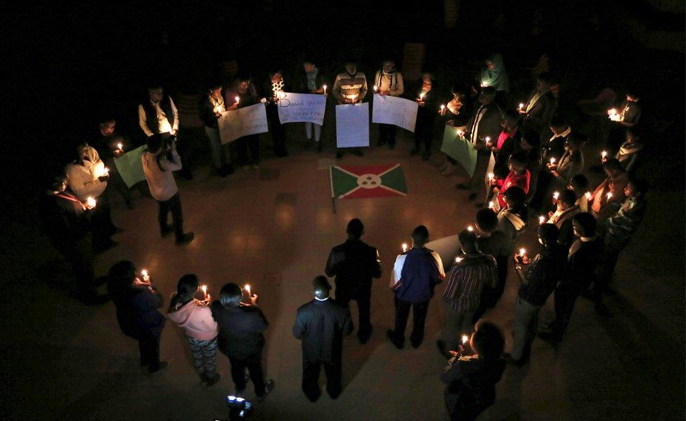 Students from the Catholic University light candles during a night vigil in solidarity with the Burundian people in Kenya's capital Nairobi,