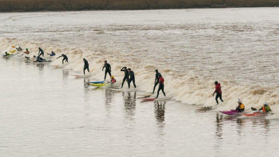 Surfers ride the Severn Bore