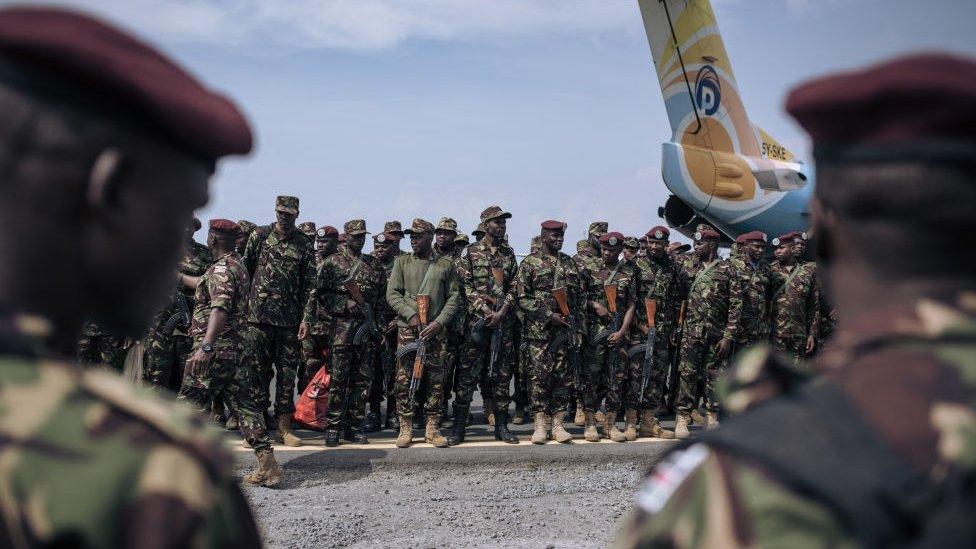 Kenyan soldiers from the East African Community regional force (EAC-RF) prepare to leave the Democratic Republic of Congo, at Goma airport, on December 3, 2023.