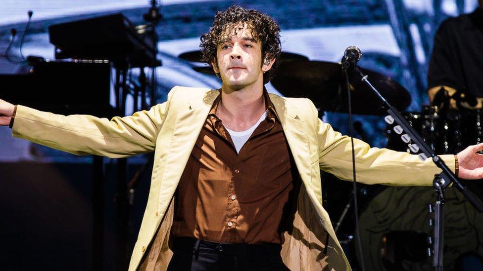 The 1975 frontman Matt Healy performing on stage in Brazil on 25/3/2023