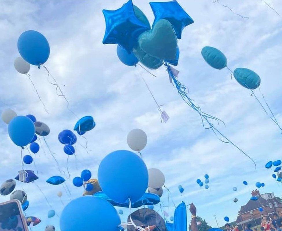 About 200 blue balloons were released by Kellum's family and friends in his memory