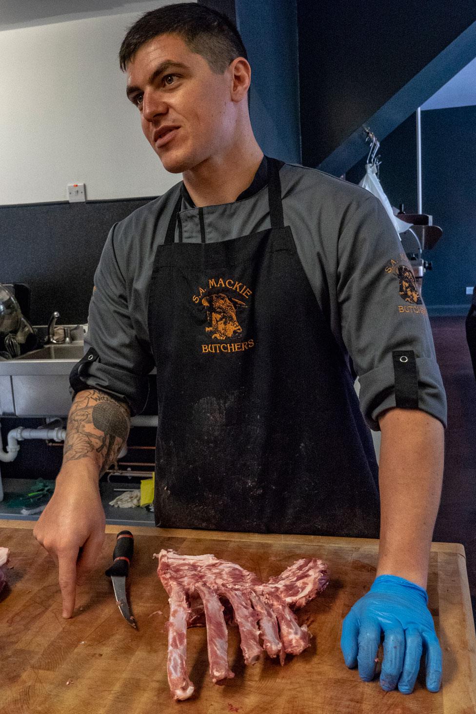 Callum Wright as a butcher