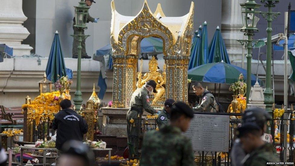 Police investigate the scene around the Erawan Shrine the morning after an explosion in Bangkok,Thailand, Tuesday, Aug. 18, 2015.