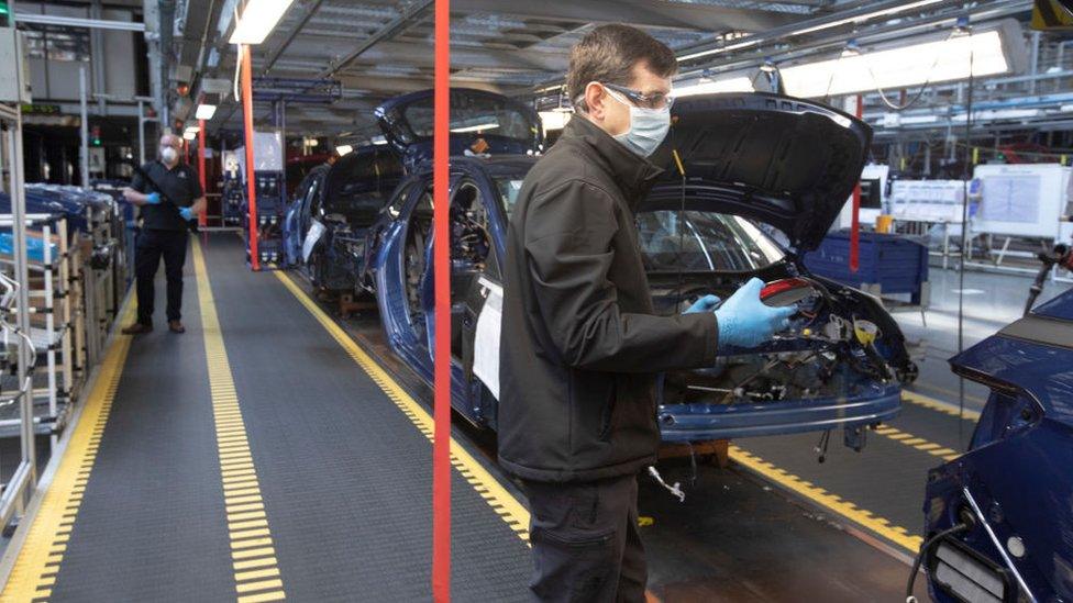 Workers wearing masks at Vauxhall's Ellesmere Port factory