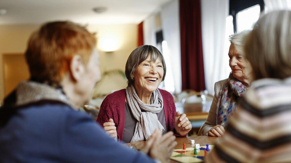 Women playing a board game