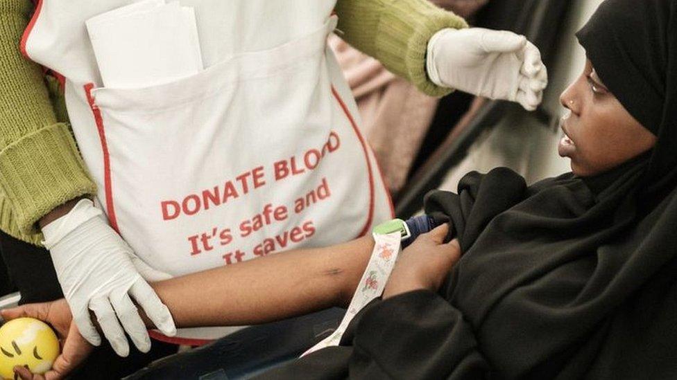 Khadija Njambi Sadiki, a student of RAF International University, donates her blood for the first time following Friday prayer at the Jamia Mosque, on January 18, 2019, after an Islamist attack on a Nairobi hotel complex that left 21 dead in Nairobi, Kenya. (Photo by Yasuyoshi CHIBA / AFP) (Photo credit should read YASUYOSHI CHIBA/AFP via Getty Images)