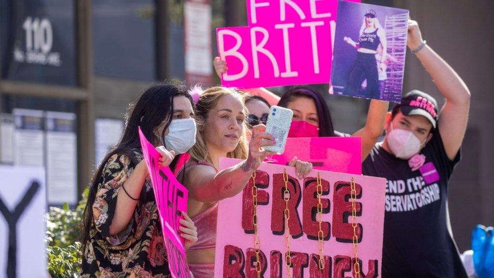 Supporters of singer Britney Spears gather outside a courthouse